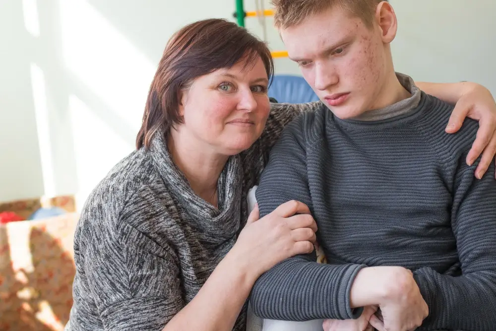 boy-with-disability-rehabilitation-center-with-special-needs-his-mother (1)