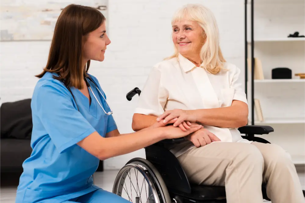 caregiver taking care of woman in wheelchair