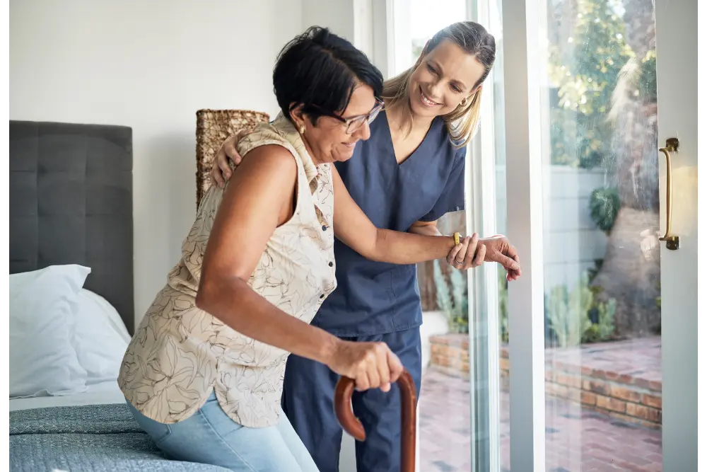 happy woman nurse senior elderly care support walking with stick